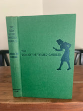 The Sign of the Twisted Candles