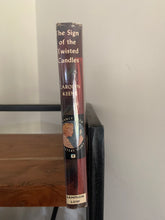 The Sign of the Twisted Candles