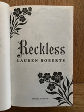 Reckless with red sprayed edges