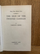 The Sign of the Twisted Candles